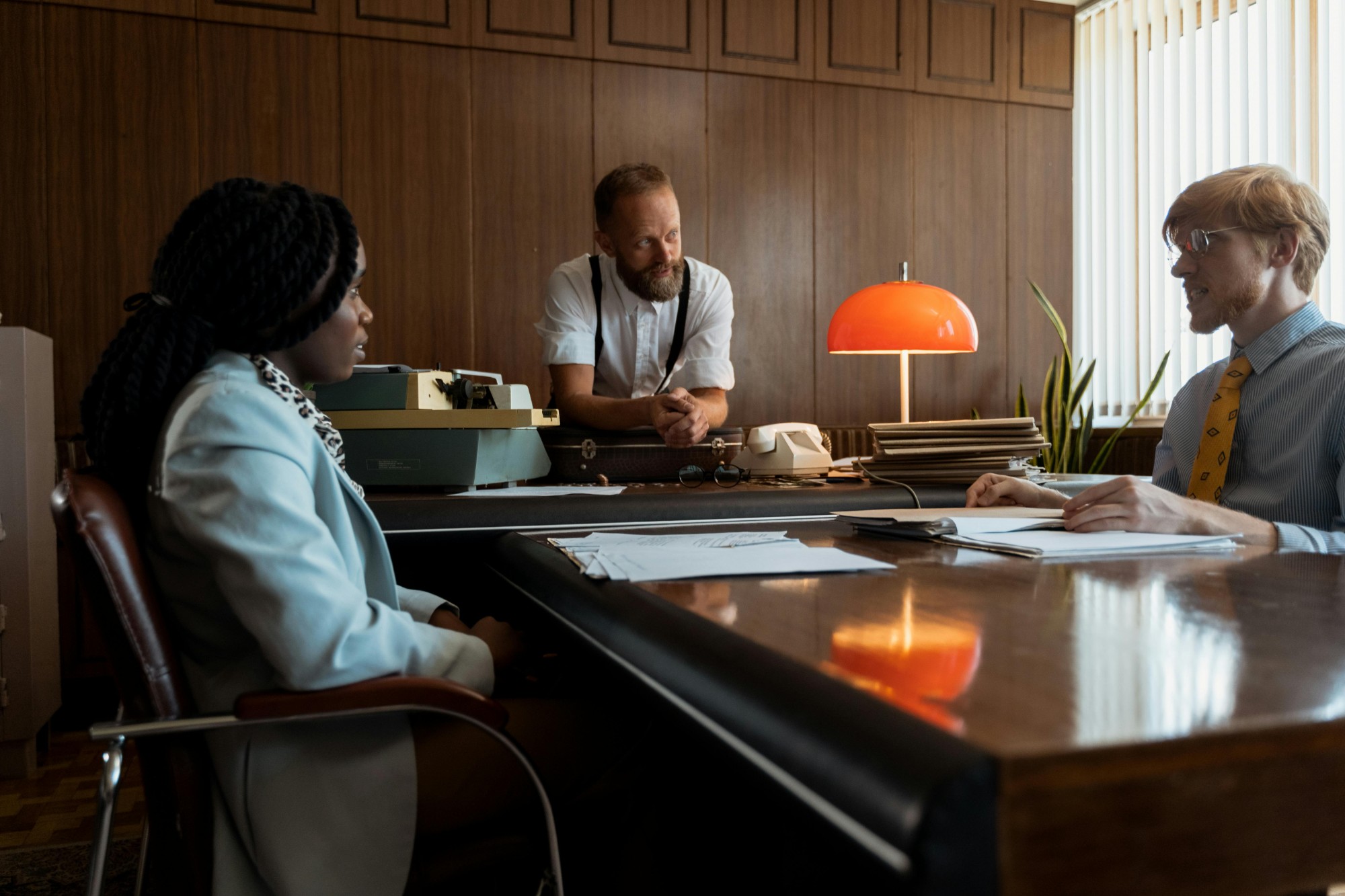 Interview across a desk — employee misconduct investigation